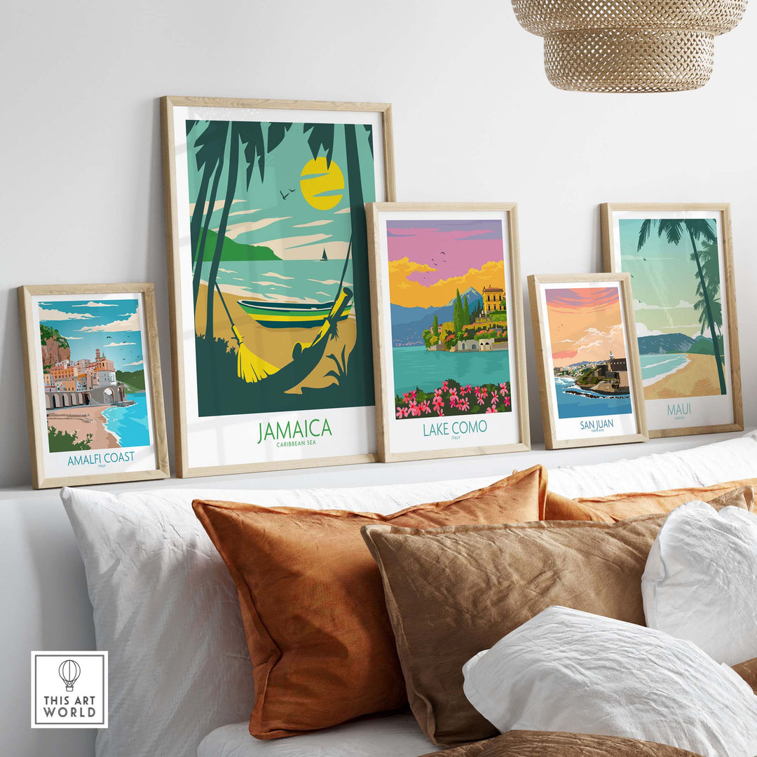 Stylish travel posters featuring Jamaica, Lake Como, San Juan, and Maui displayed on a modern sofa.