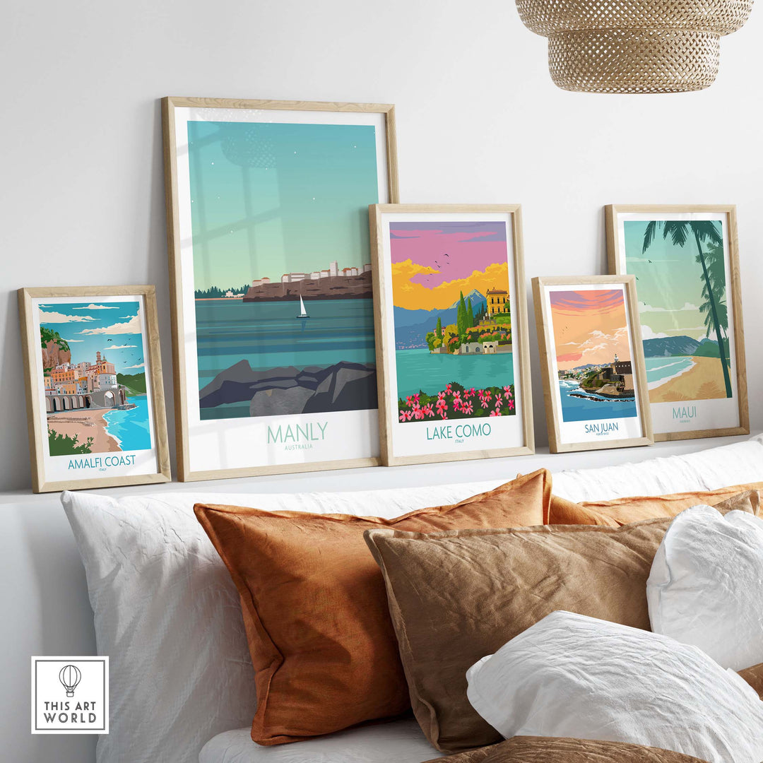 Manly Wall Art Australia travel posters in stylish frames displayed on a sofa, perfect for home decor.