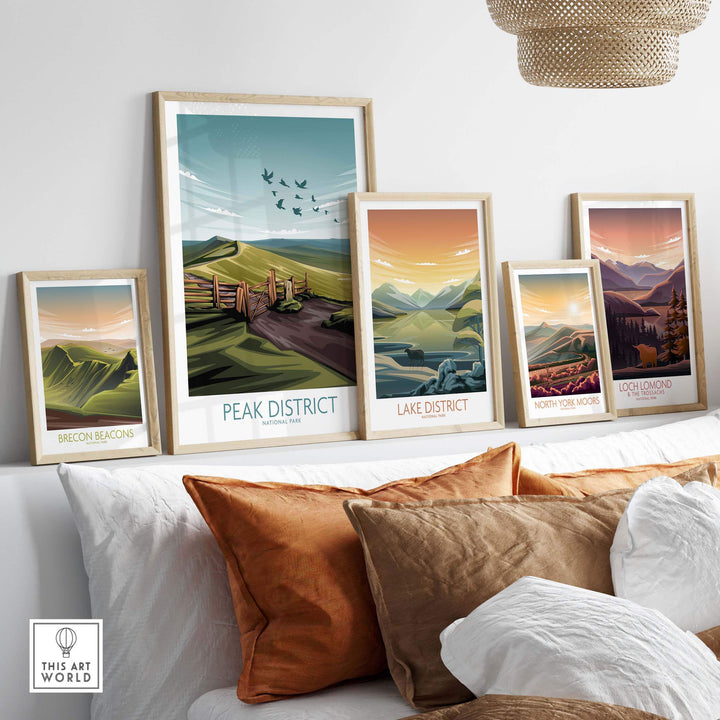 Framed Lake District and Peak District posters displayed in a modern interior, showcasing vibrant nature scenes.