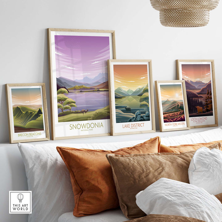 Framed travel posters of Snowdonia, Lake District, and more, showcasing minimalist nature art in a stylish interior.