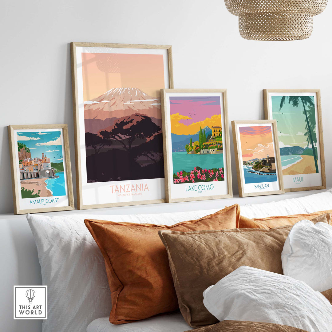 Stylish Kilimanjaro Print Tanzania poster displayed among vintage travel art prints on a sofa.