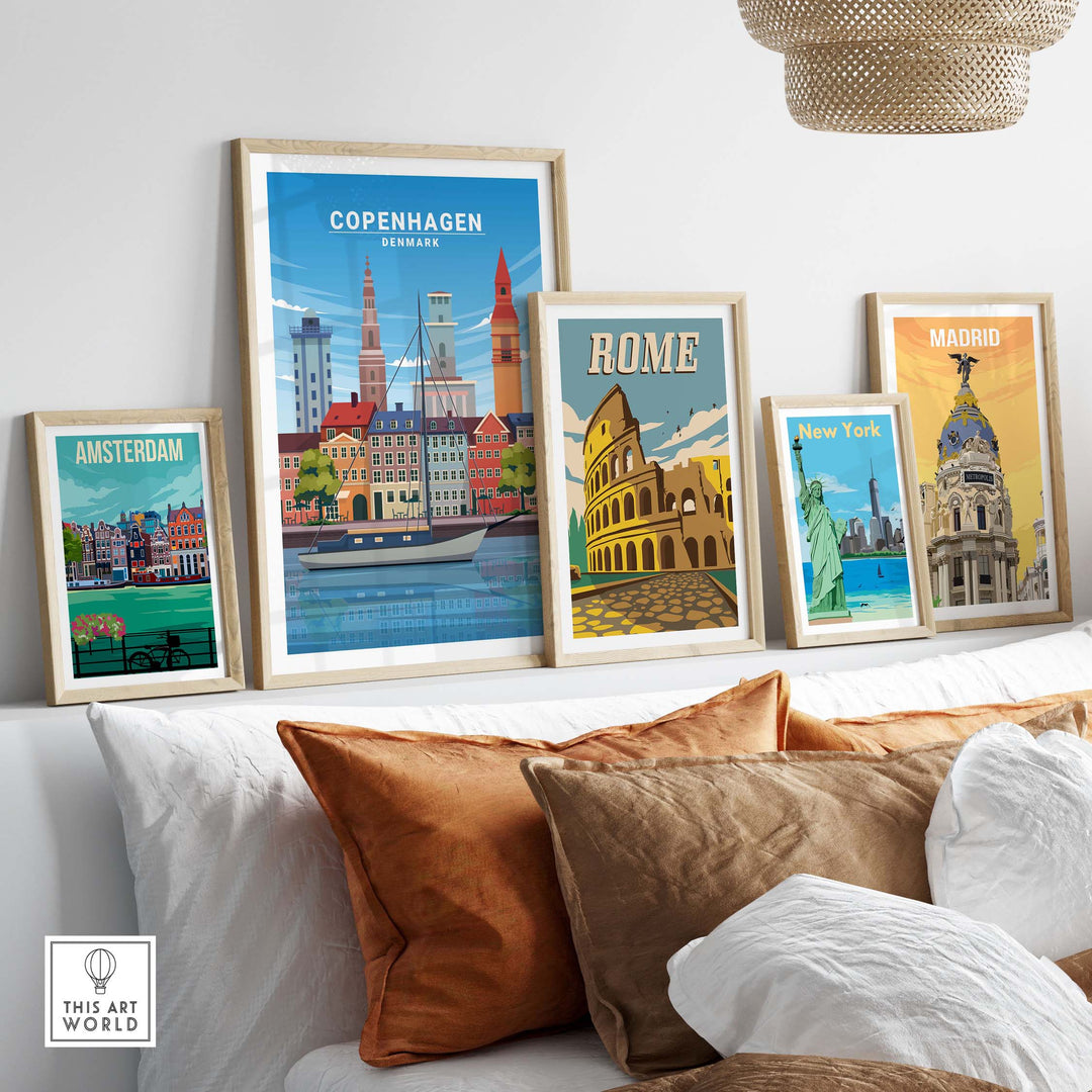 Framed Copenhagen Print and travel posters of Amsterdam, Rome, New York, and Madrid displayed on a cozy sofa.