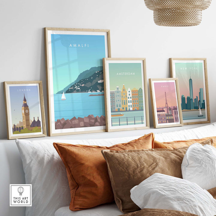 Framed Amalfi Coast, London, Amsterdam, and Paris travel prints displayed in a stylish home setting.