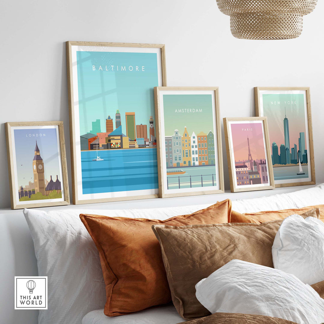 Baltimore Maryland print and vintage travel posters displayed on a wall above stylish cushions.