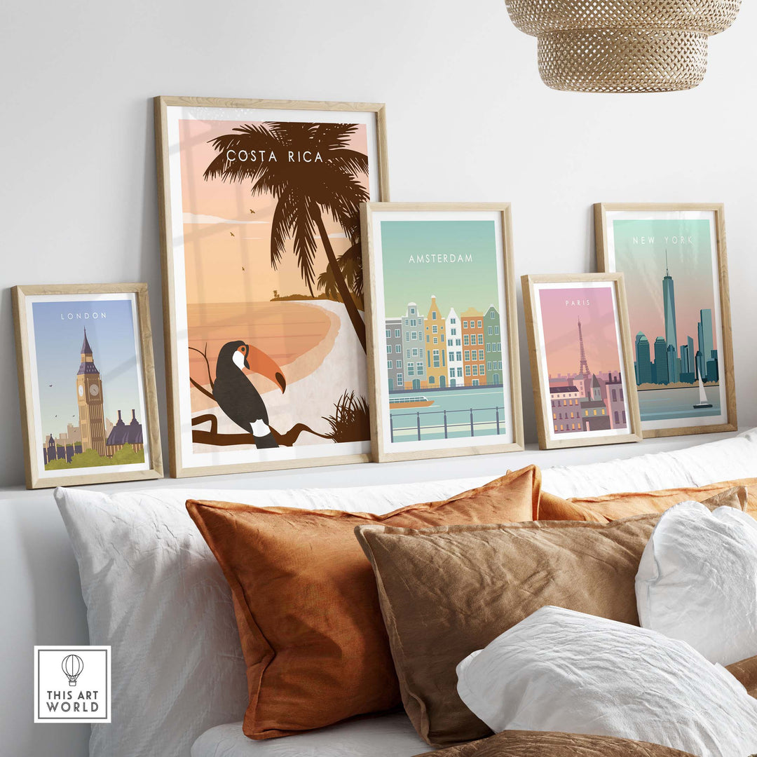 Costa Rica print wall art poster displayed among framed city travel posters on a stylish couch, showcasing wanderlust decor.