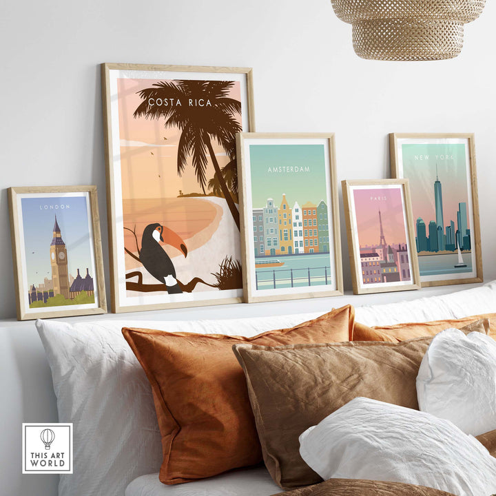 Costa Rica print wall art poster displayed among framed city travel posters on a stylish couch, showcasing wanderlust decor.