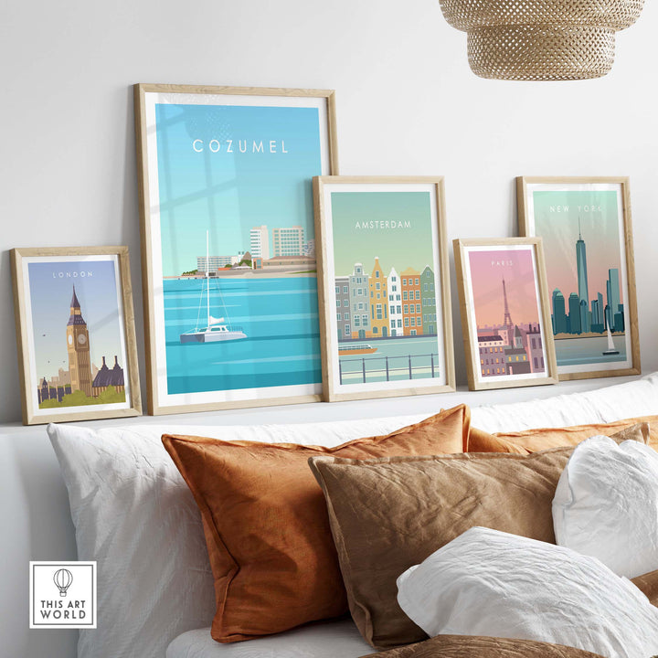 Cozumel Art Print displayed among framed vintage travel posters in a stylish home setting with decorative pillows.