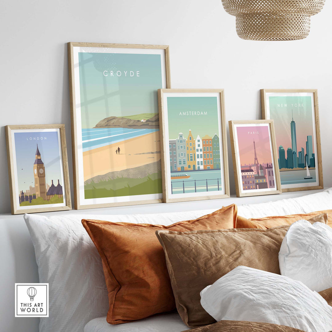 Stylish Croyde poster print wall art alongside iconic city prints in a cozy living room setting with decorative cushions.