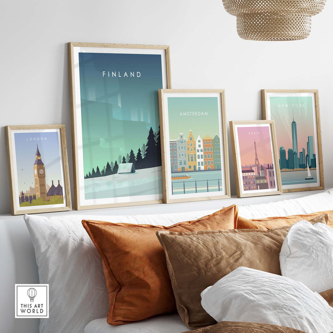 Colorful framed travel posters including Finland, London, Amsterdam, Paris, and New York on a stylish couch setup.