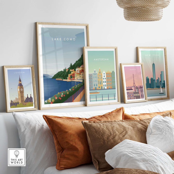 Lake Como Wall Art Poster alongside city travel prints in stylish frames on a cozy sofa setup.