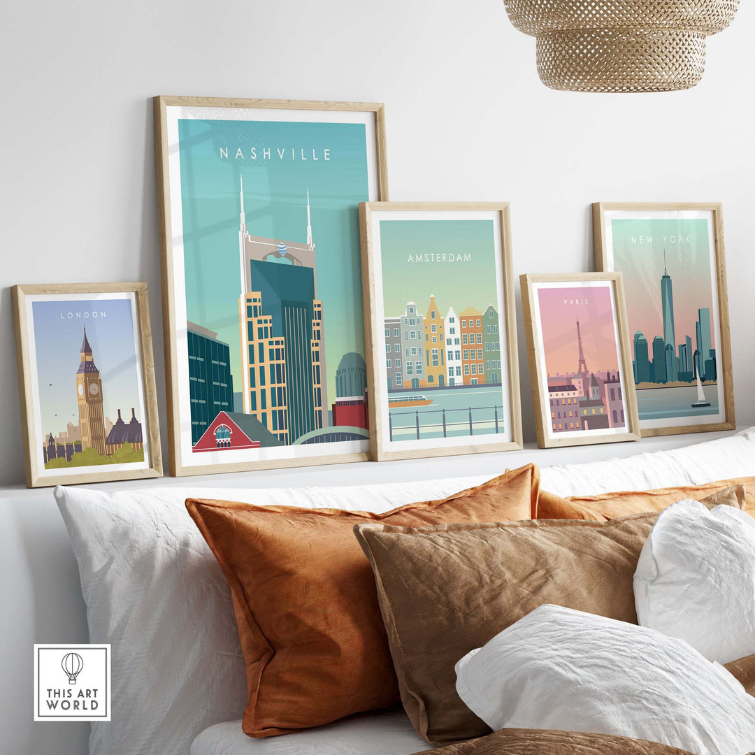 Nashville Art Print and vintage travel posters displayed on a stylish couch with decorative pillows.