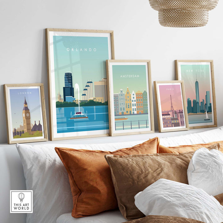 Framed travel poster prints of Orlando, London, Amsterdam, and Paris displayed in a stylish home setting.