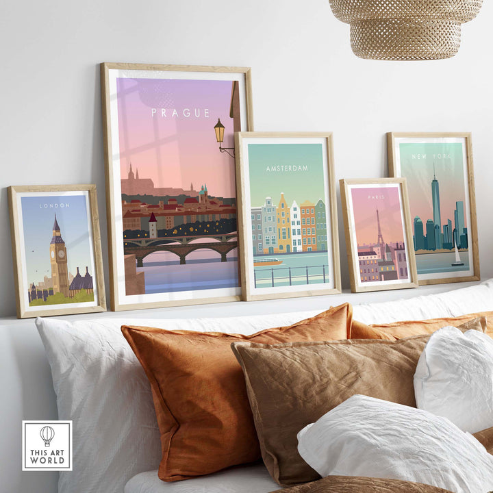 Framed travel wall art featuring iconic city prints of London, Amsterdam, New York, and Prague in a cozy living room setting.