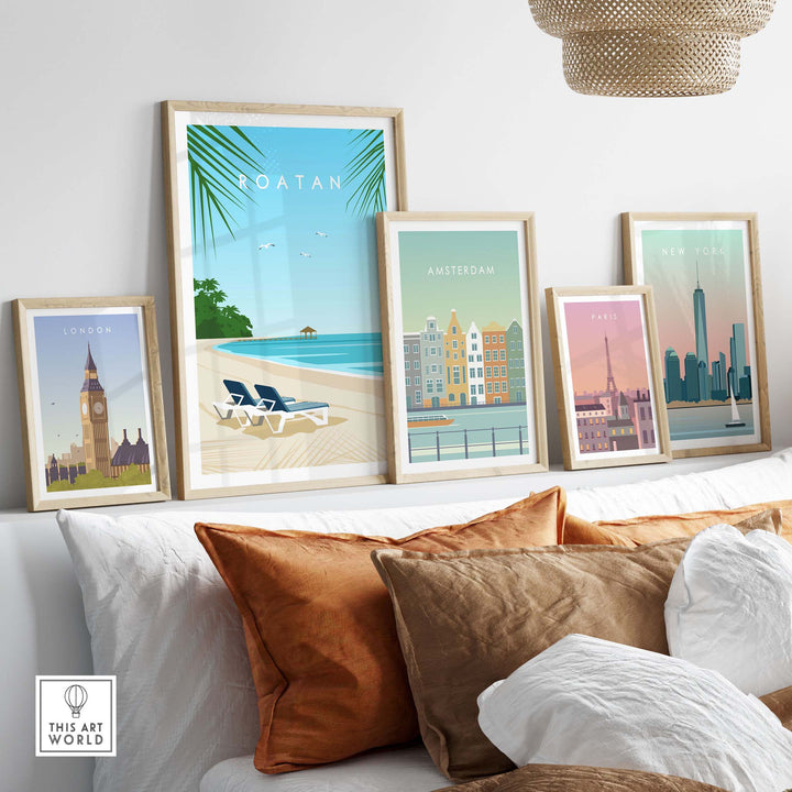 Framed Roatan and city travel art prints displayed on a wall, showcasing vintage-inspired wall decor.