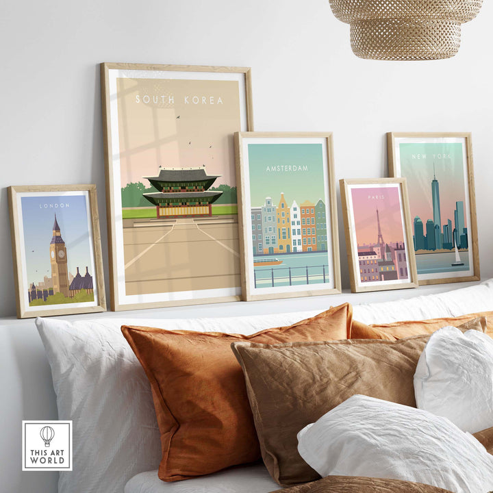South Korea poster print showcasing vintage travel art on a stylish couch with framed city posters.
