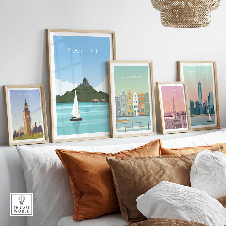 Framed Tahiti travel poster among other city posters, set against a cozy couch with decorative cushions.