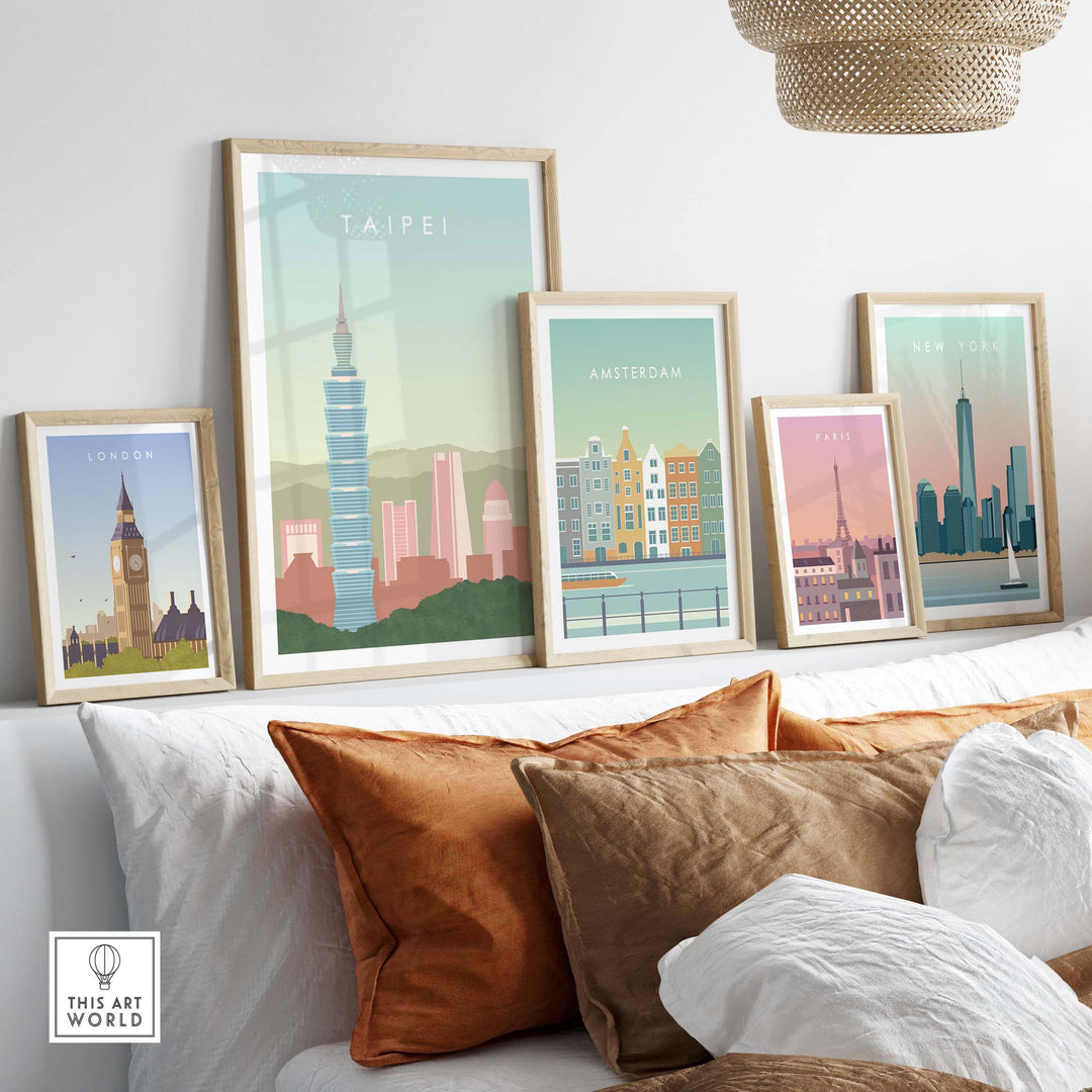 Framed Taipei poster among vintage city travel prints on a stylish sofa, showcasing wanderlust-inspired wall art.