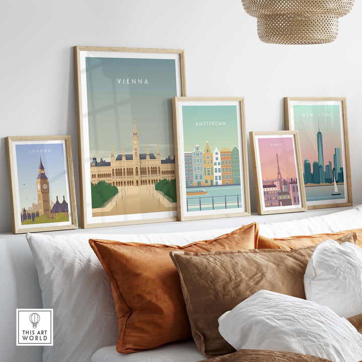 Vienna Wall Art Poster showcased among framed travel posters including London, Amsterdam, and New York on a stylish sofa.