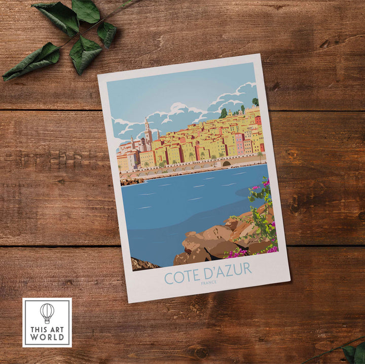 Cote d'Azur print poster featuring vibrant vintage travel art on wooden background.