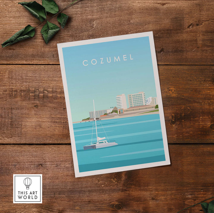 Cozumel Art Print featuring a sailboat and coastal skyline on a wooden desk