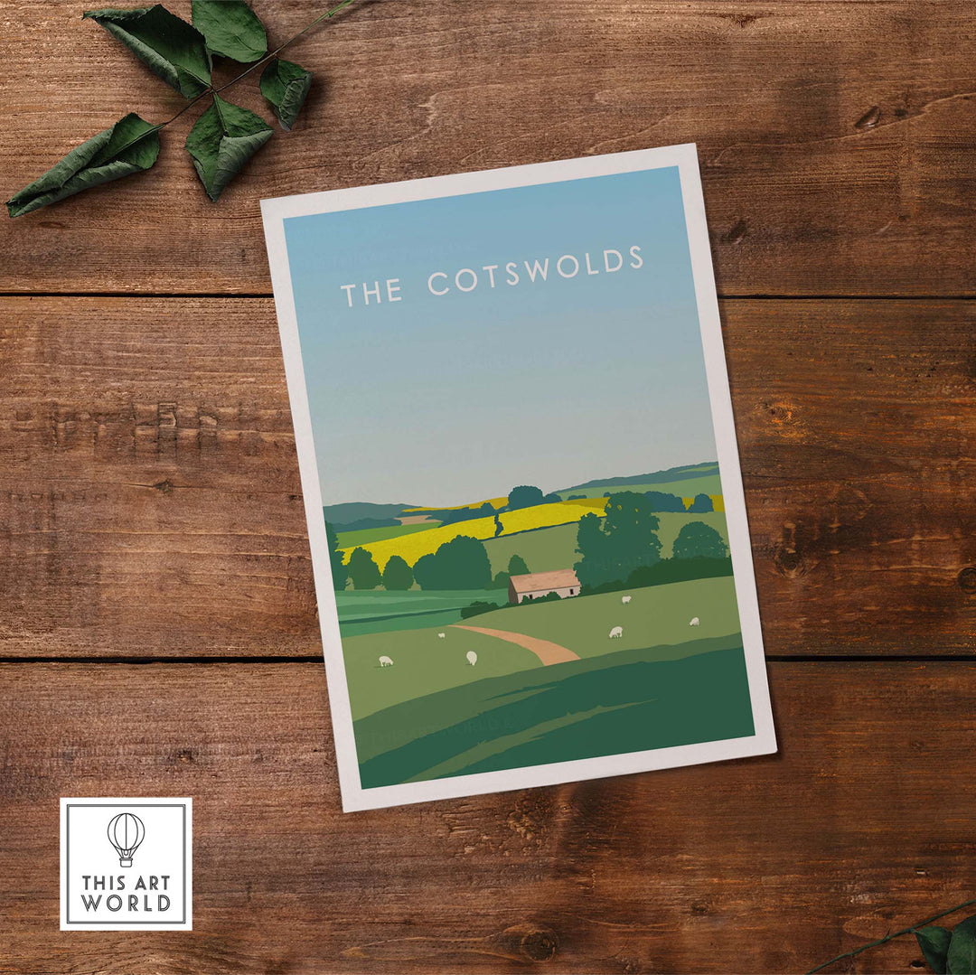 The Cotswolds poster print featuring a scenic landscape on a rustic wooden table.