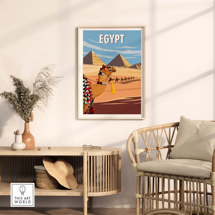 Egypt wall art print with pyramids and camel caravan, displayed in a stylish living room setting.