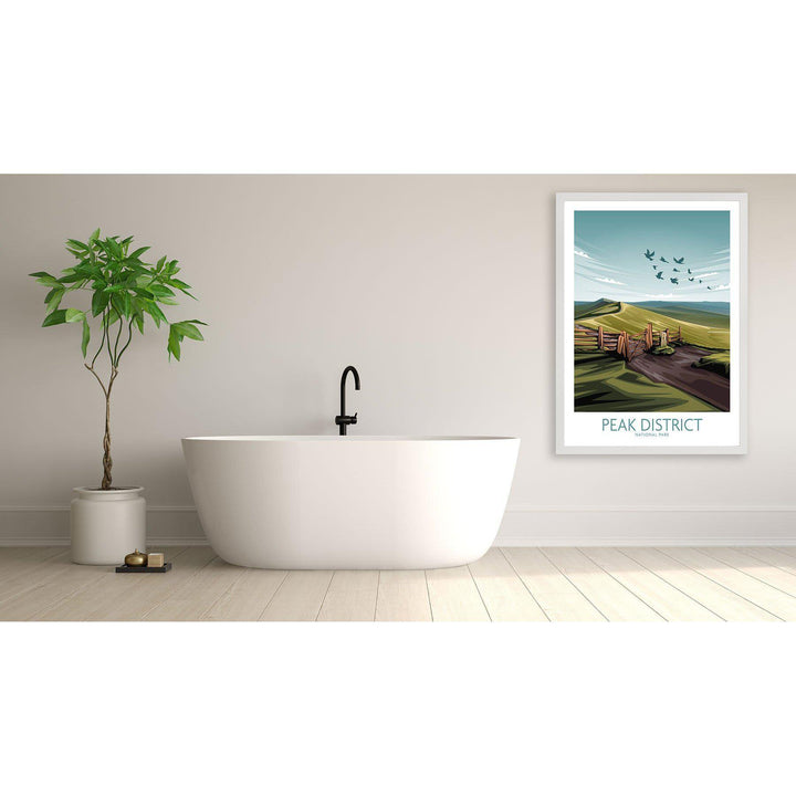 Minimalist Peak District National Park poster displayed in modern bathroom with white tub and greenery.