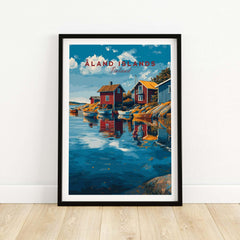 Aland Islands Finland travel poster with colorful boats, red cabins, and scenic water in a black frame