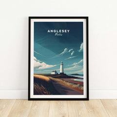 Anglesey Wales travel poster print with lighthouse and coastal landscape in black frame