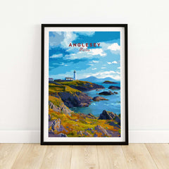 Anglesey Wales travel poster art print in black frame, coastal cliffs and lighthouse scene