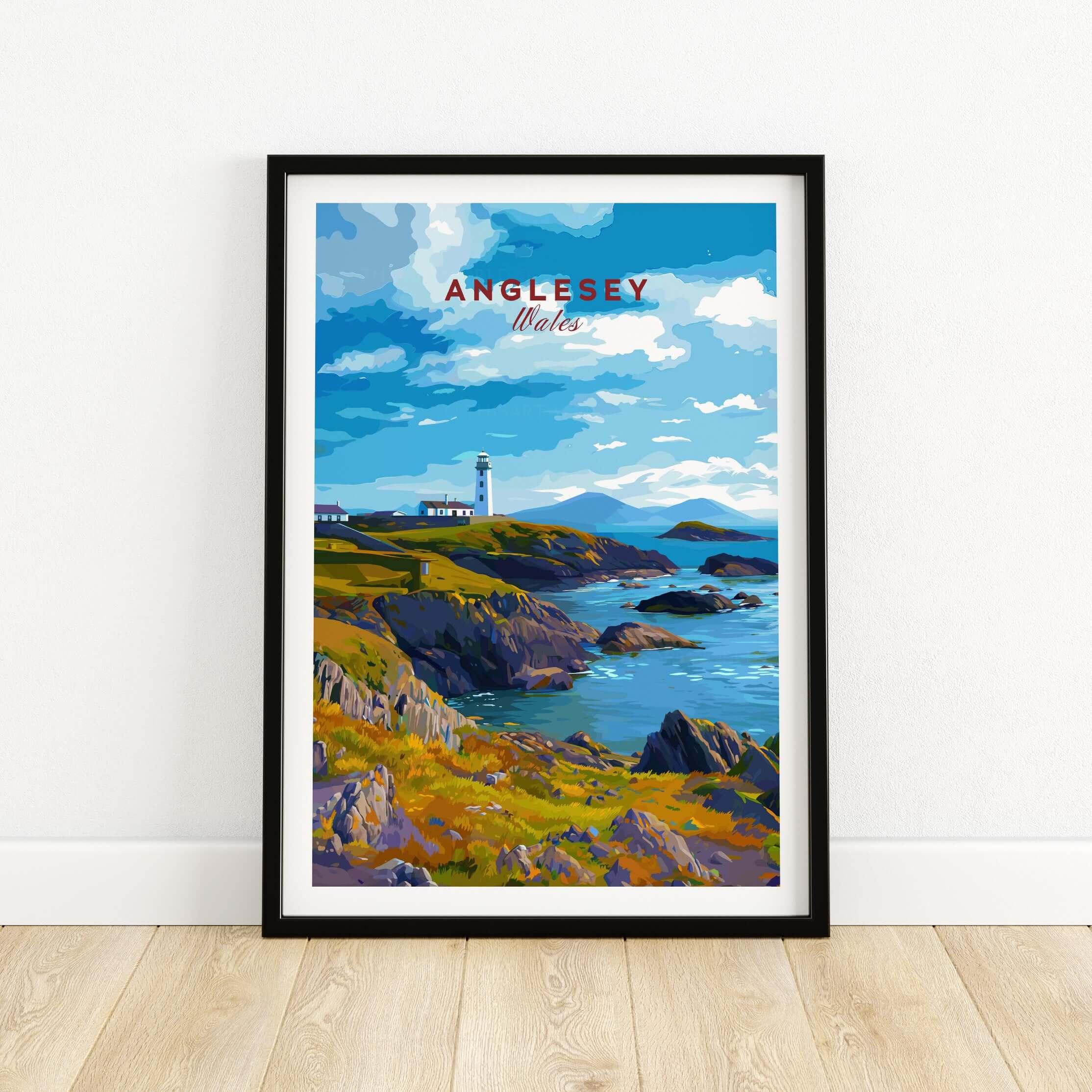Anglesey Wales travel poster art print in black frame, coastal cliffs and lighthouse scene