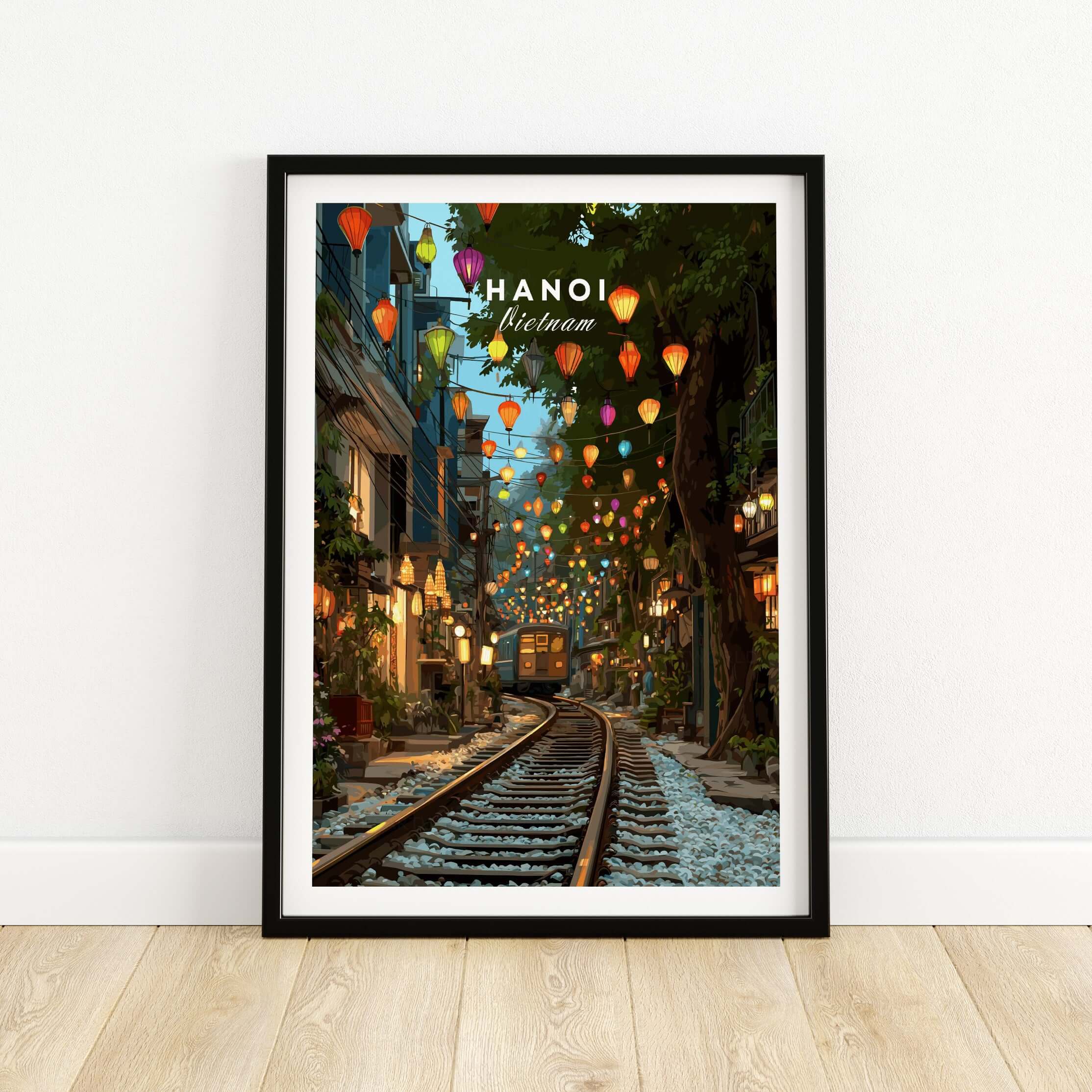 Hanoi Vietnam art print in black frame featuring train street and colorful lanterns.