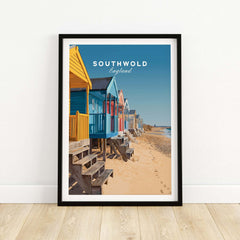 Southwold Print England showcasing colorful beach huts on sandy shore in tranquil coastal scenery.