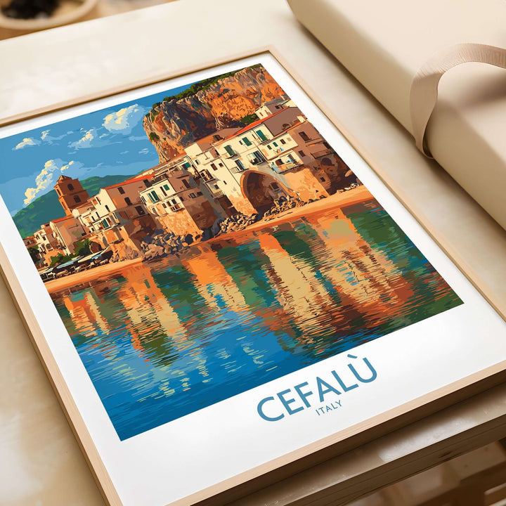 Cefalù Italy beach poster featuring the historic coastline and charming architecture reflected in water.