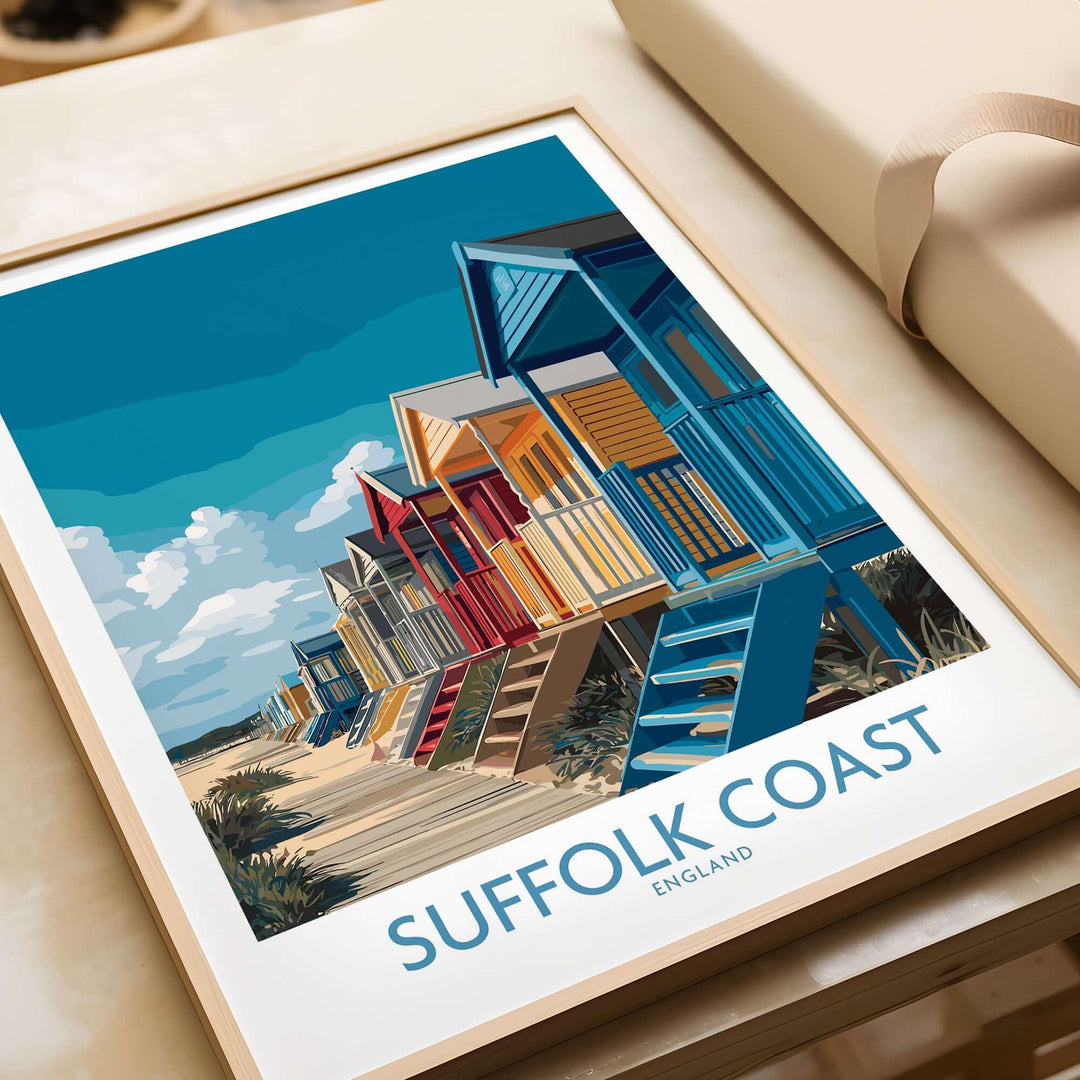 Suffolk Coast beach cabins poster featuring colorful huts and blue skies, ideal for coastal home decor.