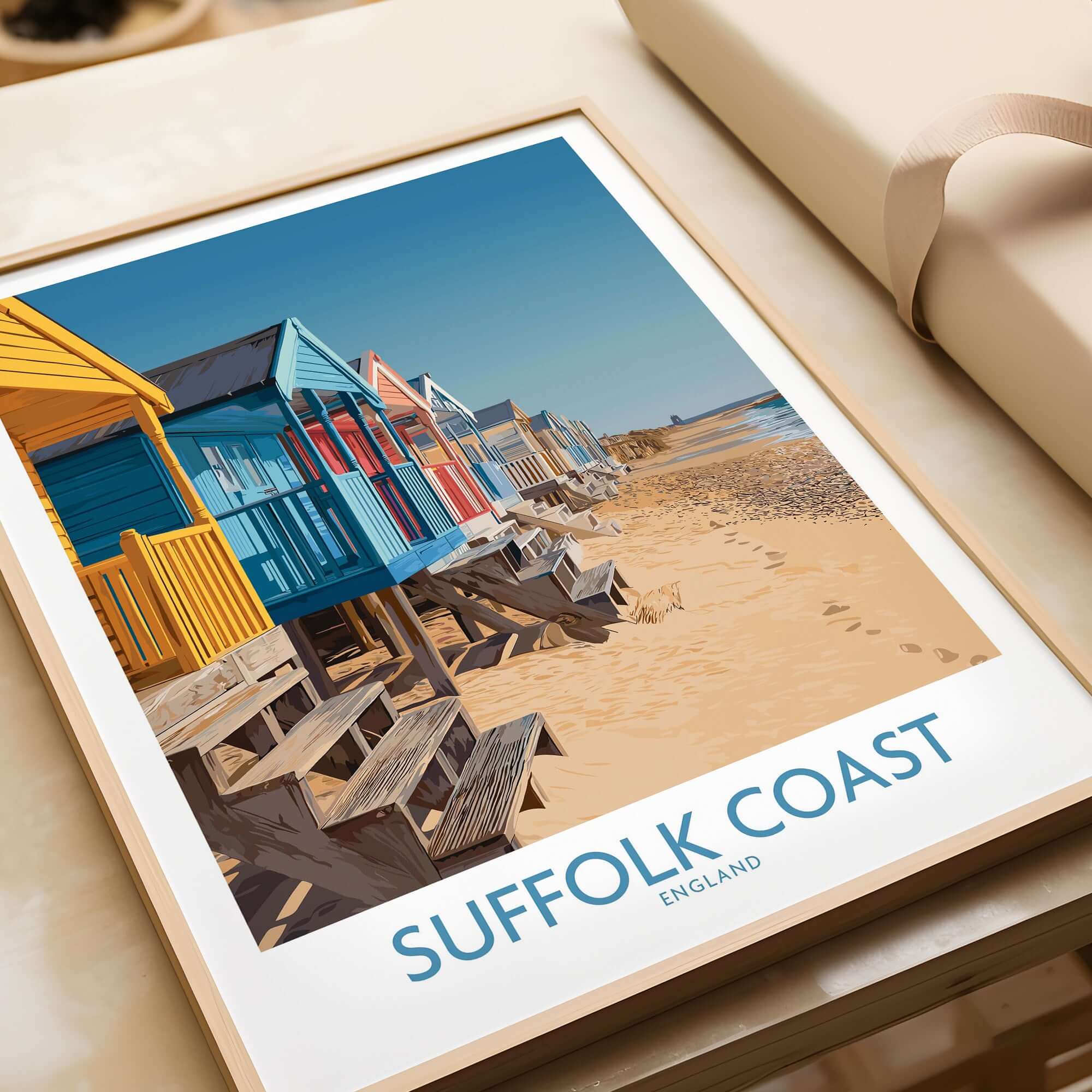 Suffolk Coast England Bright Beach Wall Art - UK Coastal Travel Decor featuring colorful beach huts on the shoreline.