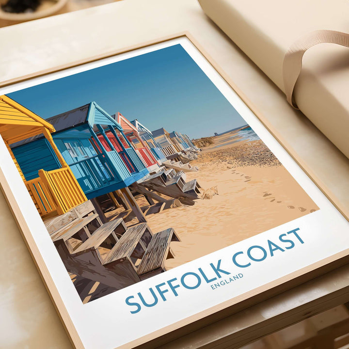 Suffolk Coast England wall art featuring colorful beach huts along the sandy shore, perfect for coastal decor.