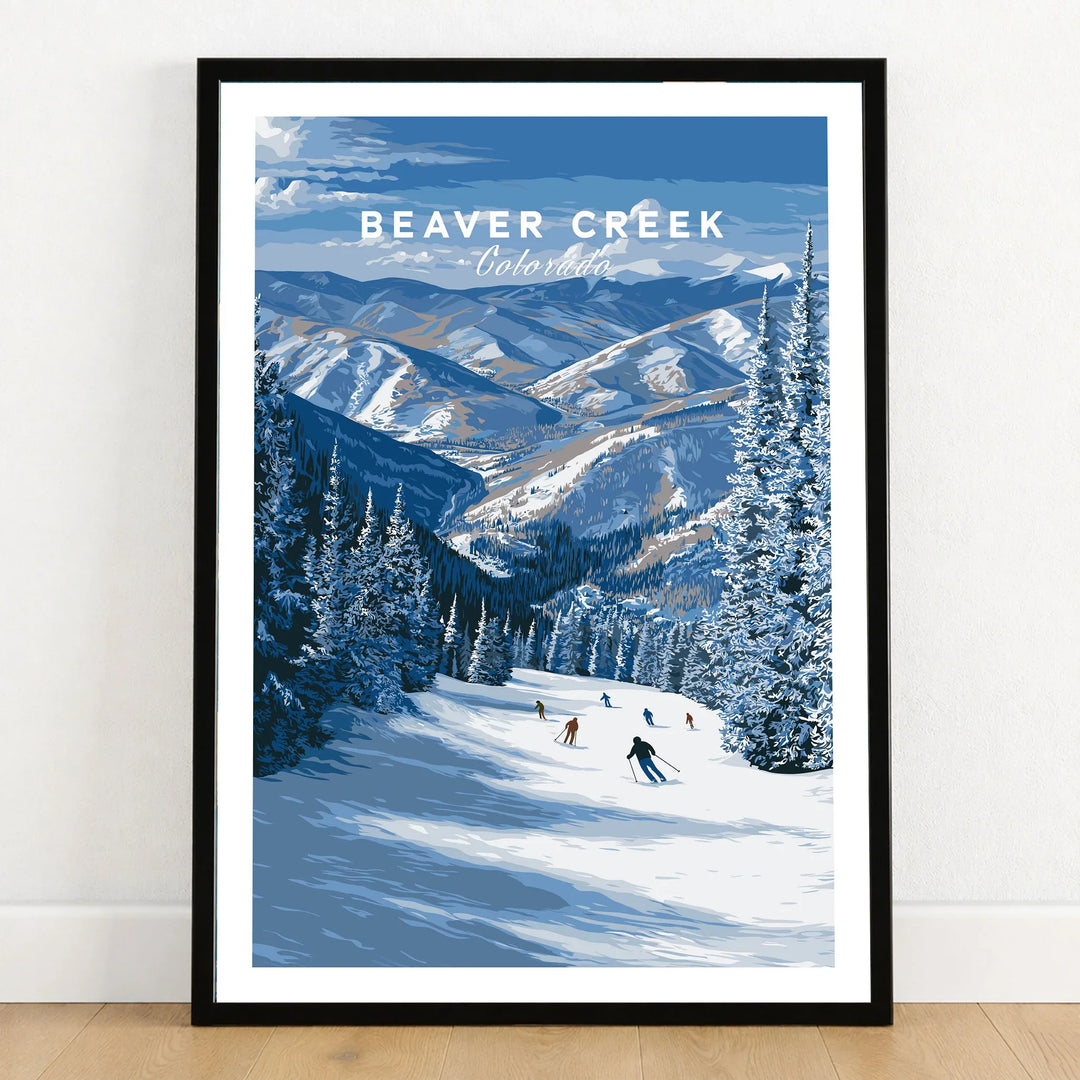 Beaver Creek Colorado Skiers on Mountain Print - Scenic Ski Resort Poster in a black wooden frame leaning against a white wall on a light wooden floor