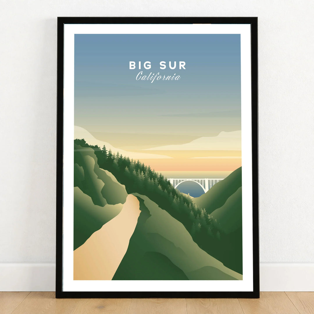 Big Sur State Park Art in a black wooden frame leaning against a white wall on a light wooden floor