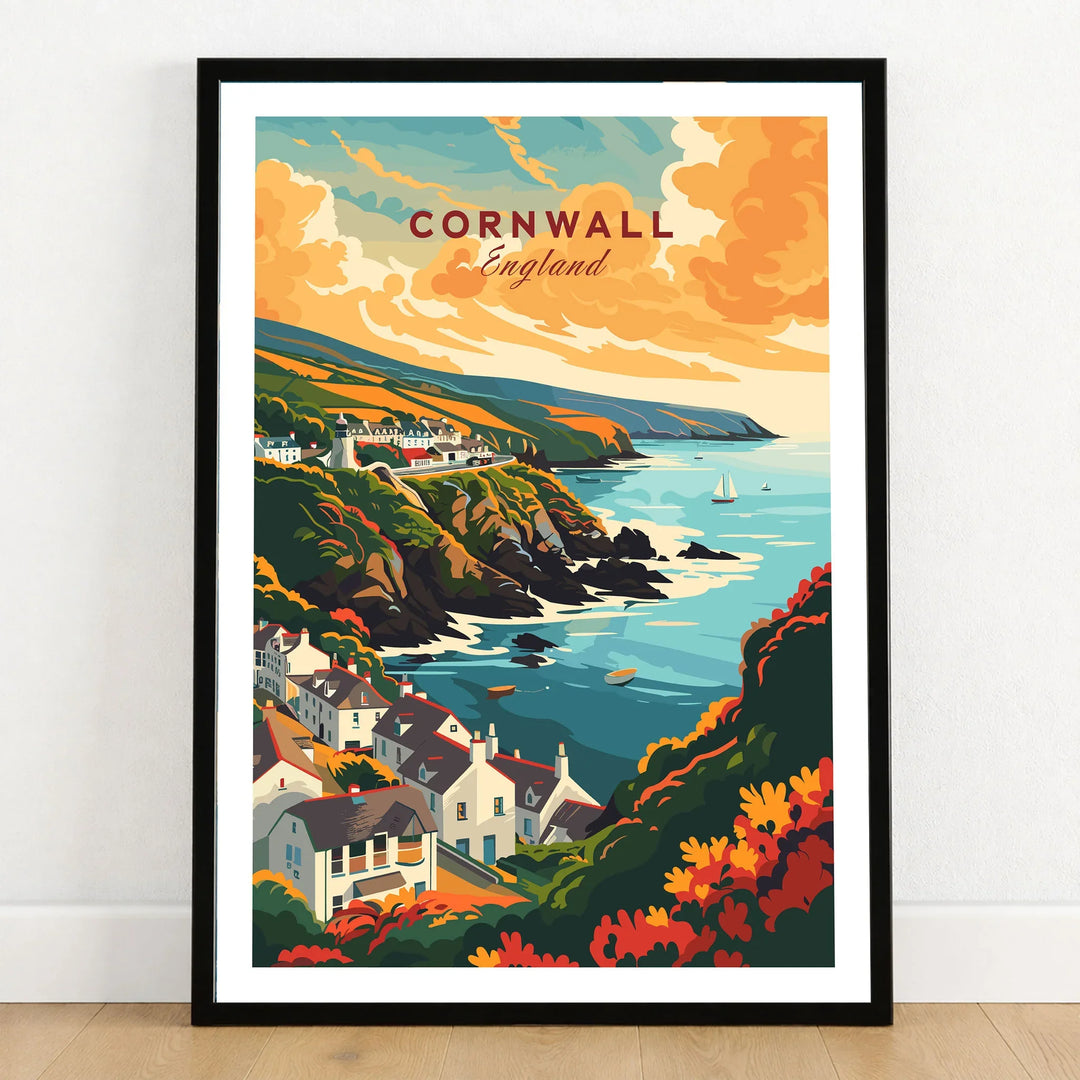 Cornwall Travel Print in a black wooden frame leaning against a white wall on a light wooden floor
