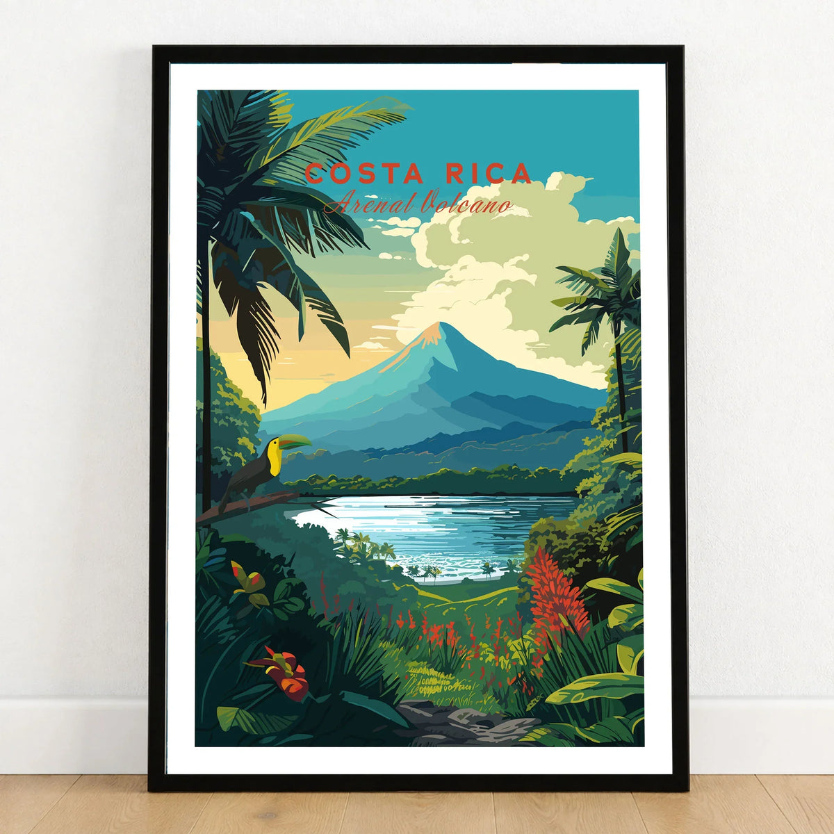 Costa Rica Print in a black wooden frame leaning against a white wall on a light wooden floor