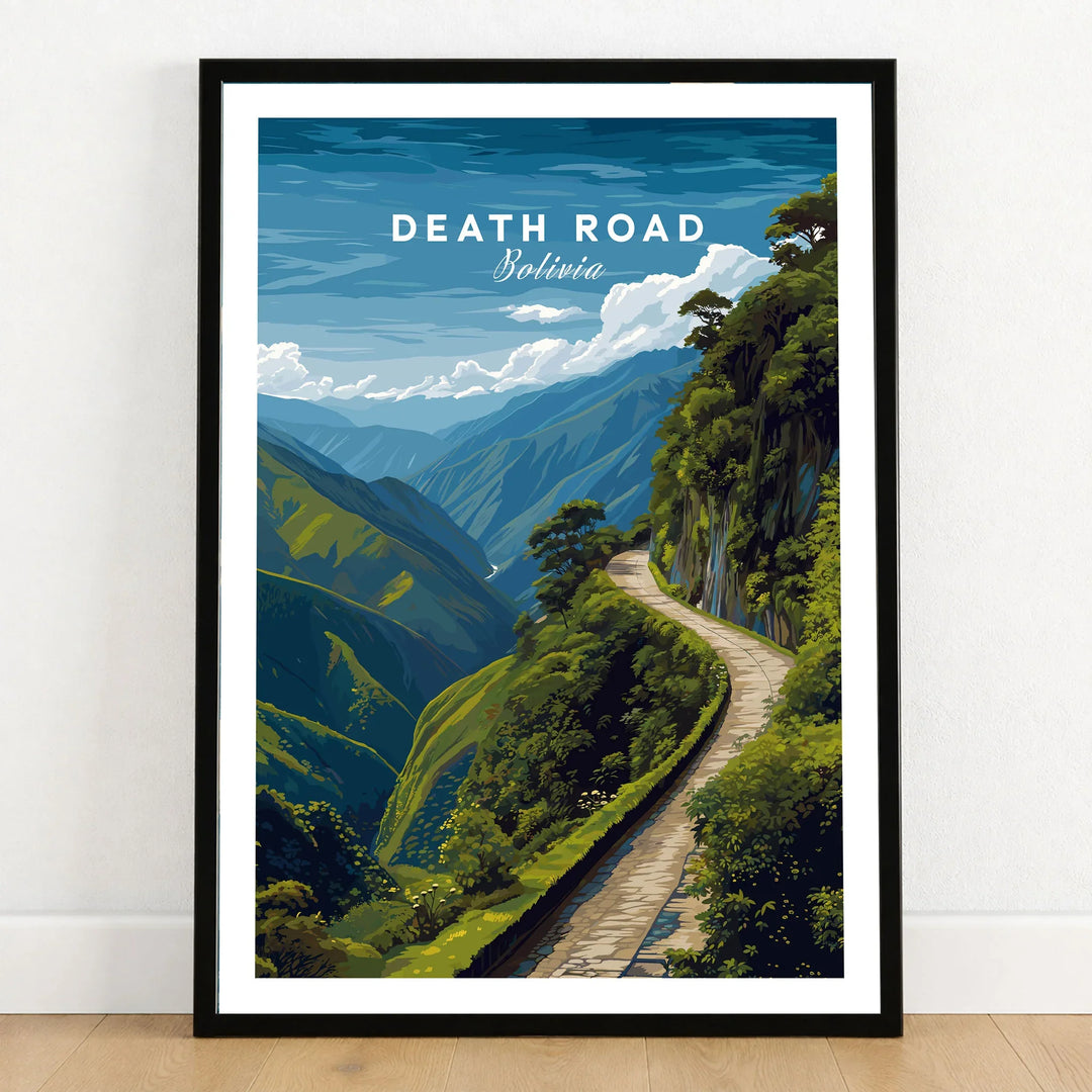 Death Road Andes Print | Yungas Road Poster in a black wooden frame leaning against a white wall on a light wooden floor