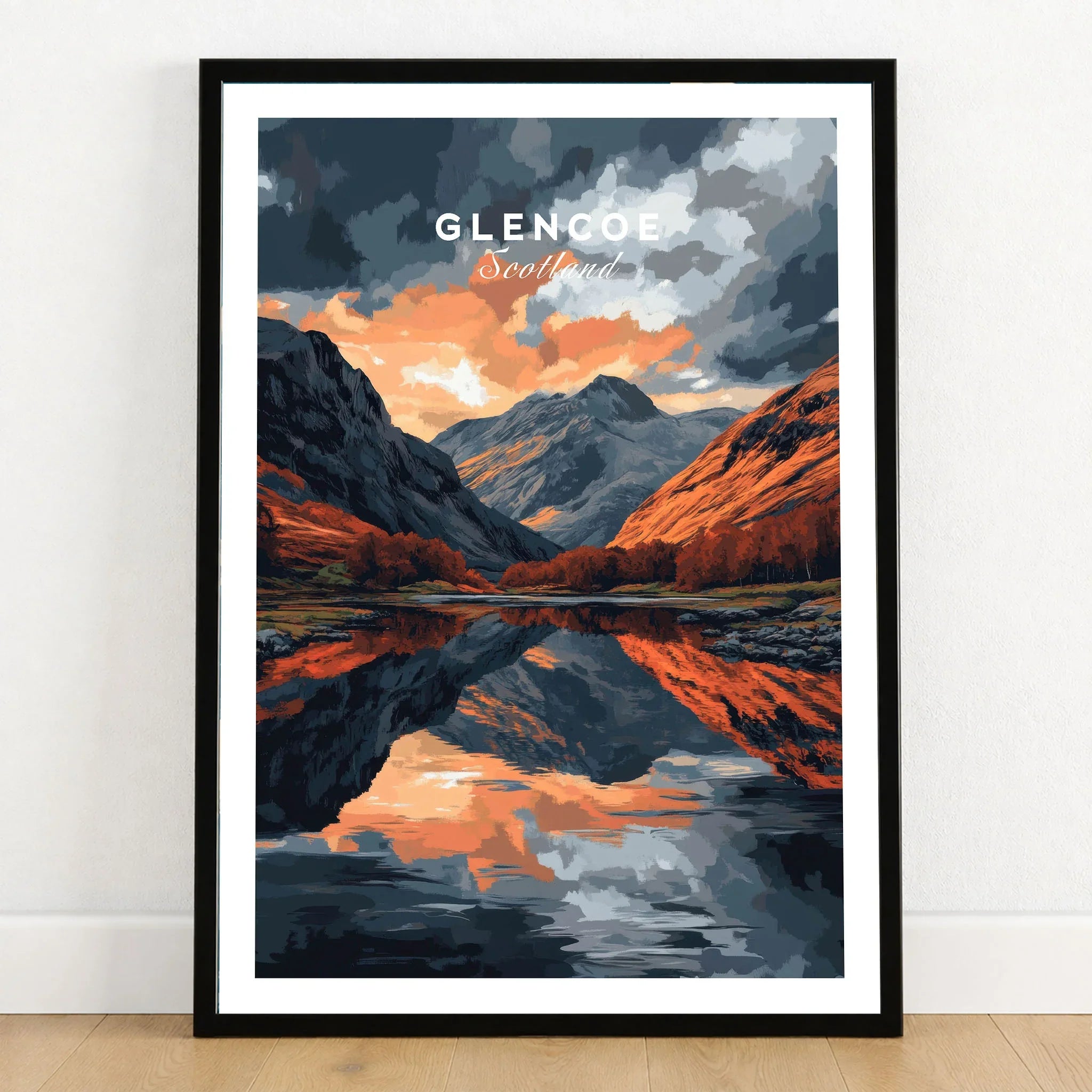 Glencoe Wall Art in a black wooden frame leaning against a white wall on a light wooden floor