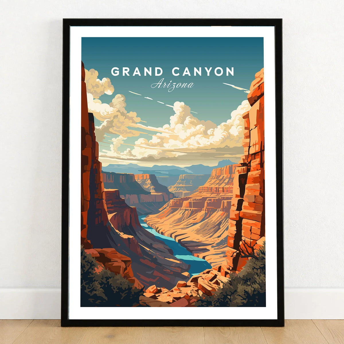 Grand Canyon Poster in a black wooden frame leaning against a white wall on a light wooden floor