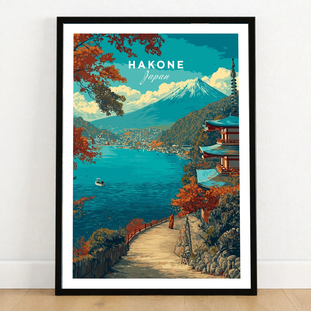 Hakone Print Japan Lake View Pagoda - Mount Fuji Scenic Poster in a black wooden frame leaning against a white wall on a light wooden floor