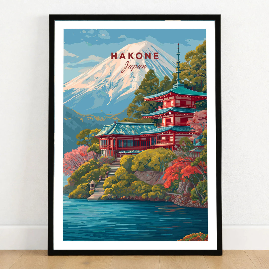 Hakone Japan Print Historic Shrine Lake Ashi Art - Mount Fuji Pagoda Poster in a black wooden frame leaning against a white wall on a light wooden floor