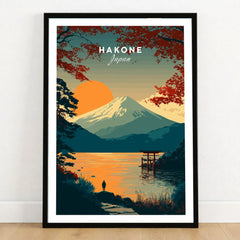 Hakone Japan Torii Gate Sunset Poster - Mount Fuji Lake Scene Print in a black wooden frame leaning against a white wall on a light wooden floor