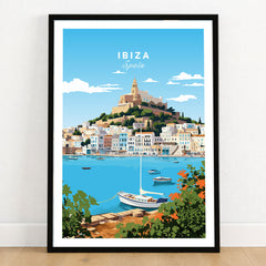 Ibiza Print in a black wooden frame leaning against a white wall on a light wooden floor