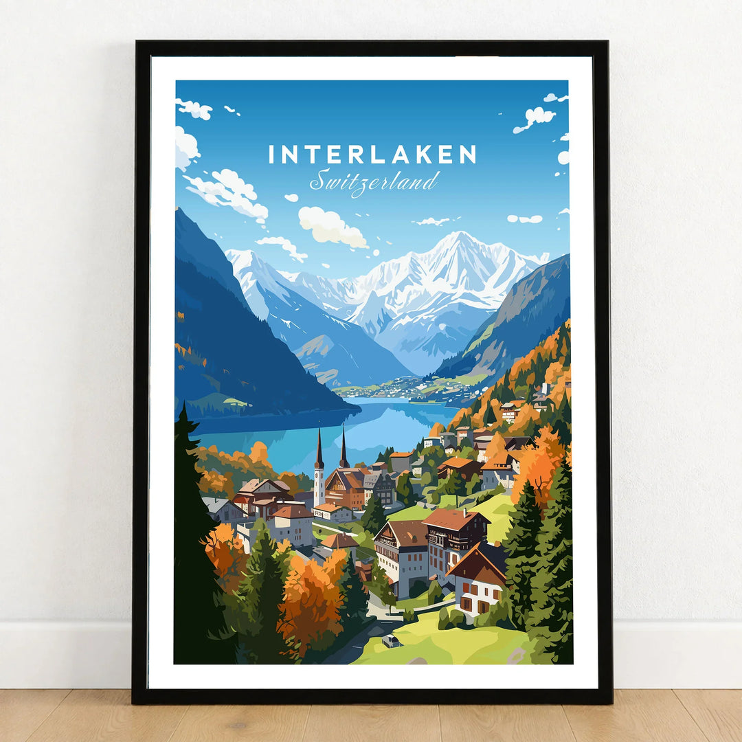 Interlaken Poster in a black wooden frame leaning against a white wall on a light wooden floor