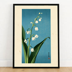 Lily of the Valley Art Print – Blue Japanese Botanical Wall Art — art print in black frame on wooden floor